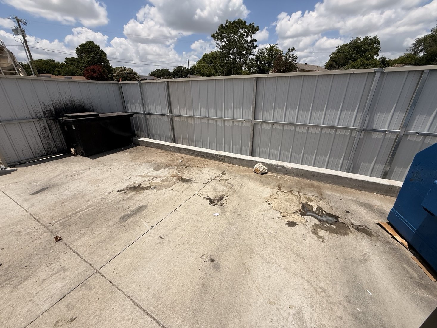 Clean dumpster enclosure